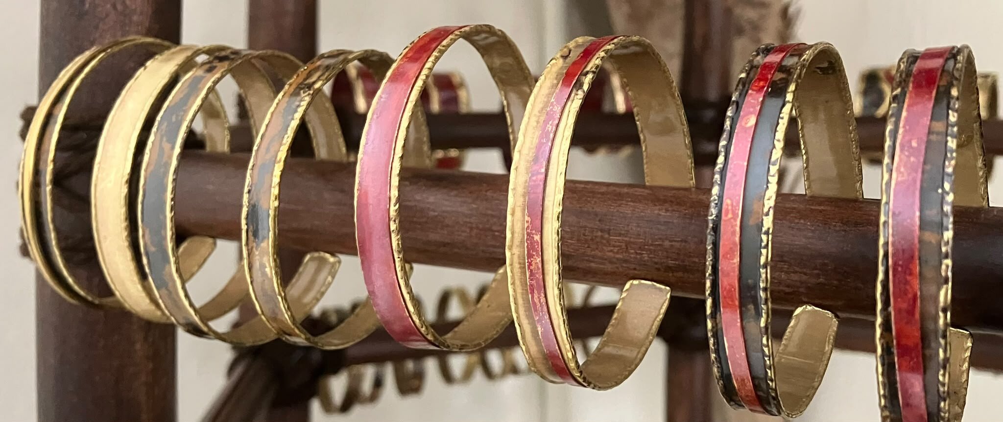 Assorted creative small bracelets with coloured inlays